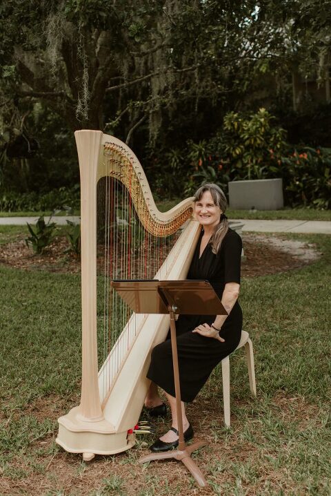harp player during outdoor ceremony at The Capen House